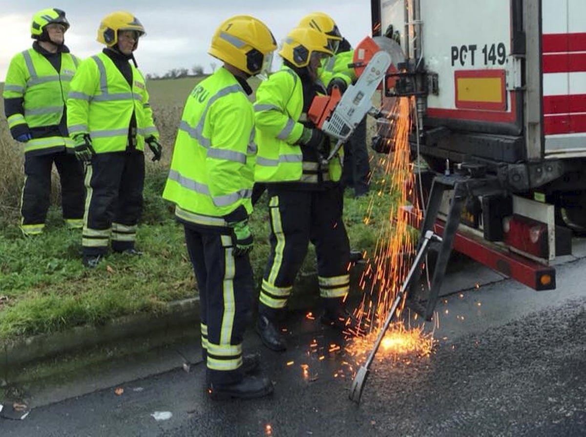 Moment firefighters cut free 11 ‘illegal immigrants’ who were SUPERGLUED into the back of a lorry by traffickers