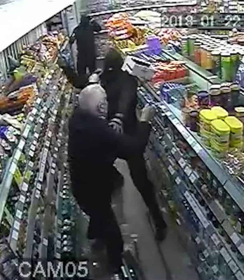 Dramatic CCTV shows have-a-go hero shopkeeper fighting off gang of thugs despite being battered with hammers