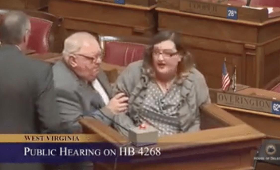 Watch: shocking scene as woman dragged out of hearing into oil lobby legislation for mentioning how much the industry is paying legislators behind it