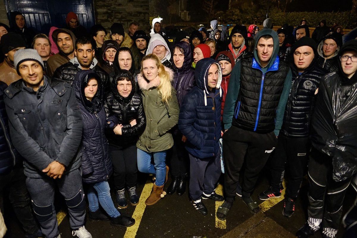 Workers gather outside police station to protest boss being arrested for modern slavery offences