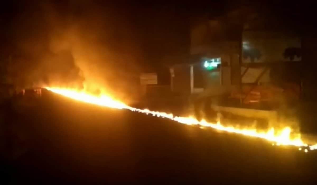 Hero drives a blazing fuel tanker away from a petrol station to save a town, leaving a river of flames in his wake.