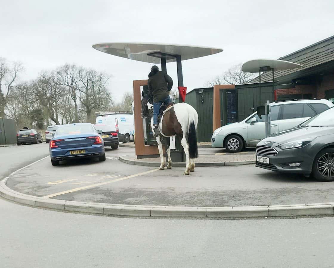 This is the hilarious moment a man tries to ride a HORSE through a McDonald’s drive-thru – before being told neigh