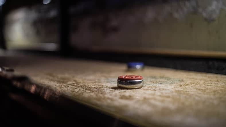 A disc of a deck shuffleboard.