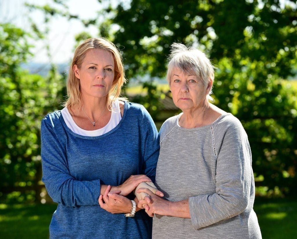 Pictured with daughter Candice Gordon, 45, Grandmother and distant cousin of the Queen, Brenda Ackerman, 71, from Worcestershire has been left facing imminent deportation following a long fought battle with the home office to remain in Worcester, despite her deteriorating health condition and her family all being British citizens. See NTI story NTIROYAL. A grandmother who is 18th cousin of the Queen is facing being deported back to South Africa after she was refused a visa to live in the UK. Brenda Ackerman, 71, traced her family tree back to the 12th Century which revealed her to be a distant relative of King John James 1st and Robert the Bruce. Mrs Ackerman was born in South Africa but fled in 2006 with her husband Brian after a string of burglaries. They moved to Dubai to be with their daughter Candice Gordon, 45, before finally settling in the UK in 2013 following the death of Mrs Ackerman’s husband Brian. Last February, Mrs Ackerman applied for a long-term visa but it was turned down, despite her suffering from a pulmonary embolism and being in failing health. Mrs Ackerman’s daughter has been granted permission to remain in the UK but the widow has now been informed she will be deported unless she returns to South Africa voluntarily. Mrs Ackerman, who currently lives with her daughter in Worcester, said: “My descendants were British.