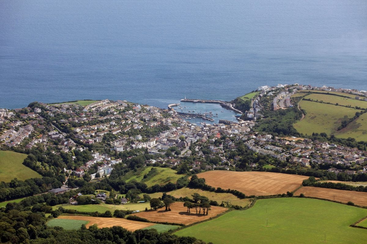 Locals who have been priced out of their pretty fishing village have voted to ban second-home owners from buying new builds in a landslide victory.  Mevagissey, in Cornwall, has seen a boom in the number of houses being purchased as holiday homes over recent years.
