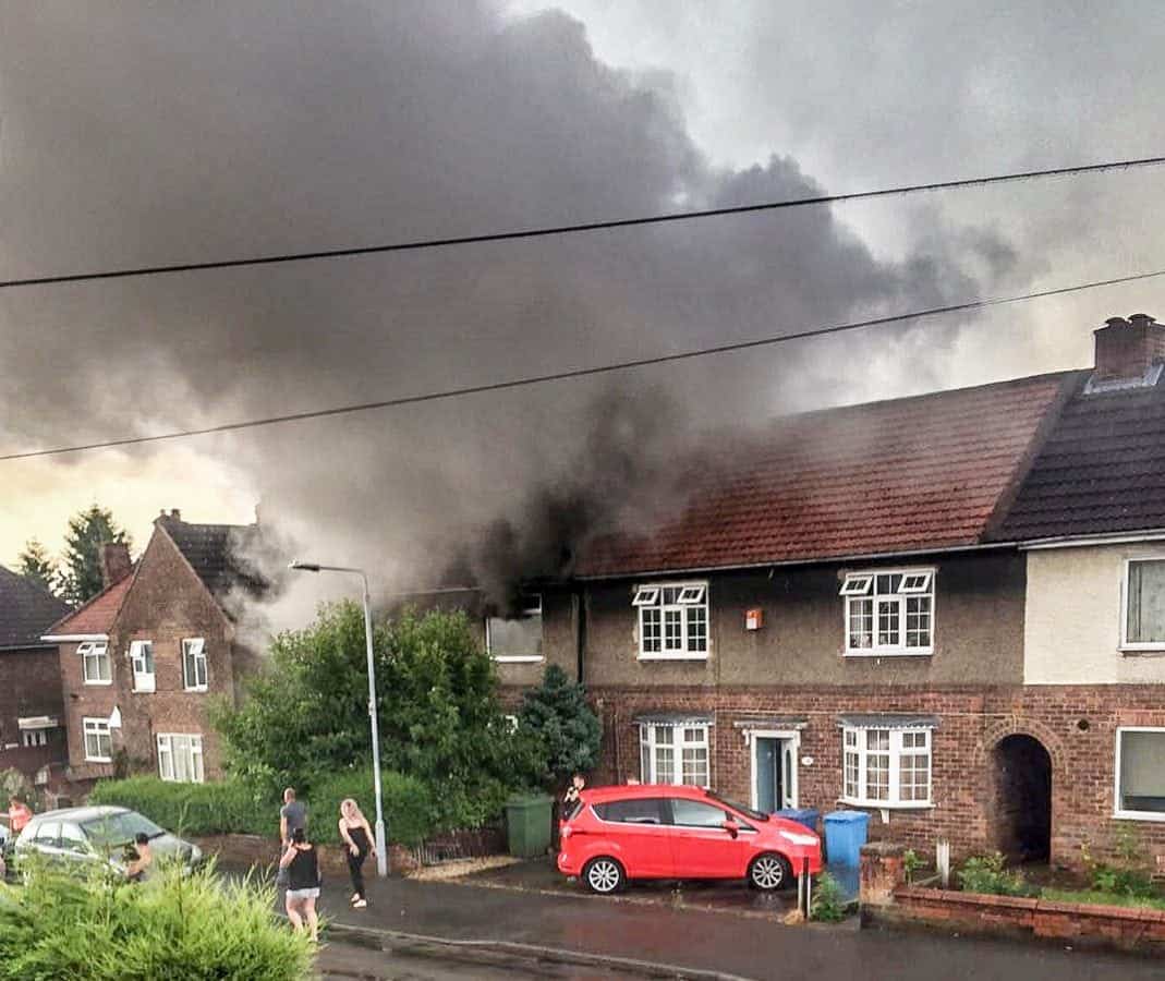 Firefighters battling a house-blaze after it was struck by lightning this morning