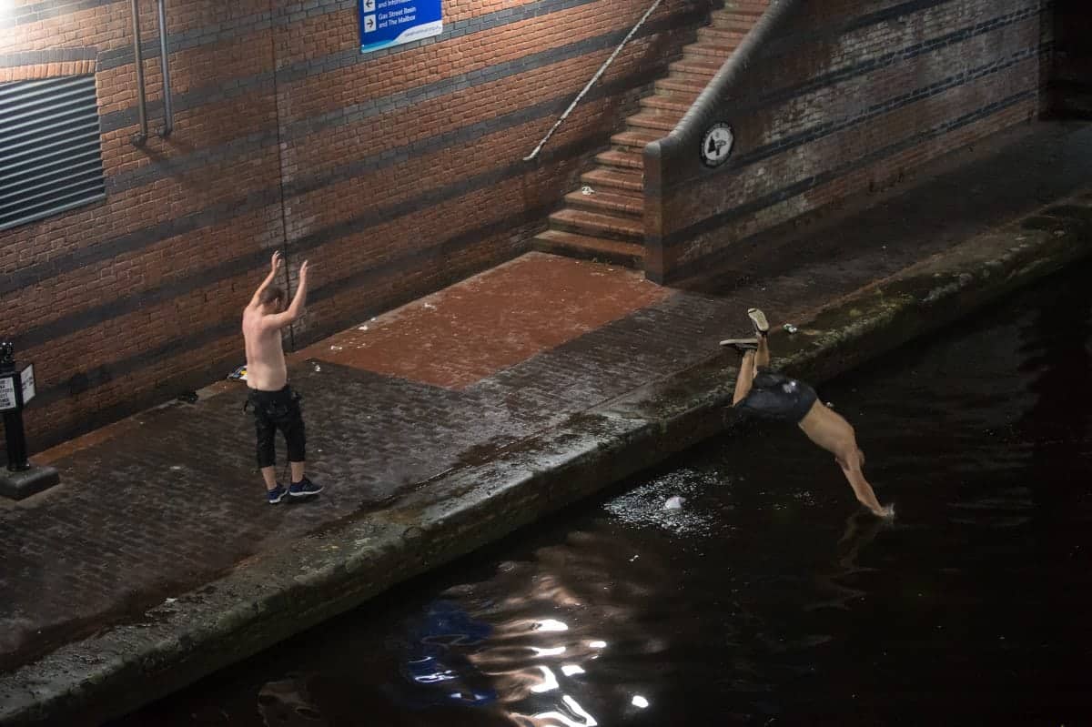 In Pics – England fans drown their sorrows by jumping in Birmingham canal