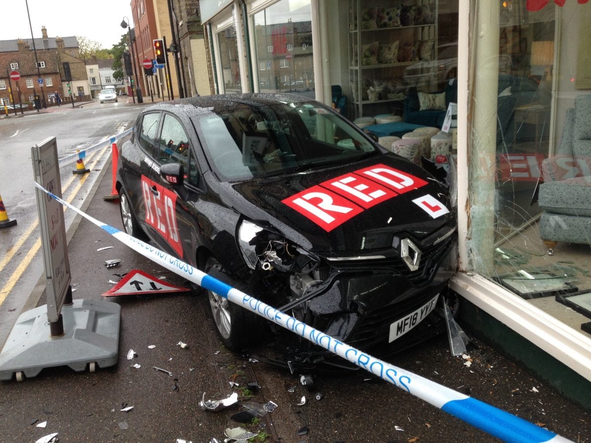 Learner driver smashes into shop window after misjudging left turn