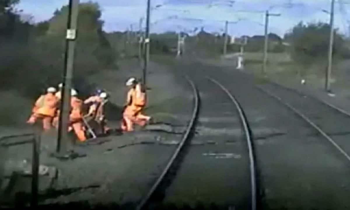 Watch – Rail workers running for their lives as 125mph train hurtles towards them