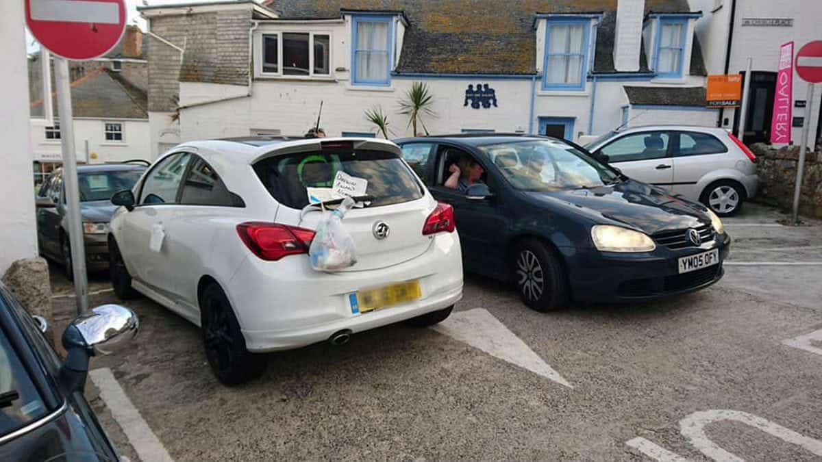 Abusive notes,gutted fish & bag of dog poo on badly parked car in packed Cornish tourist hotspot