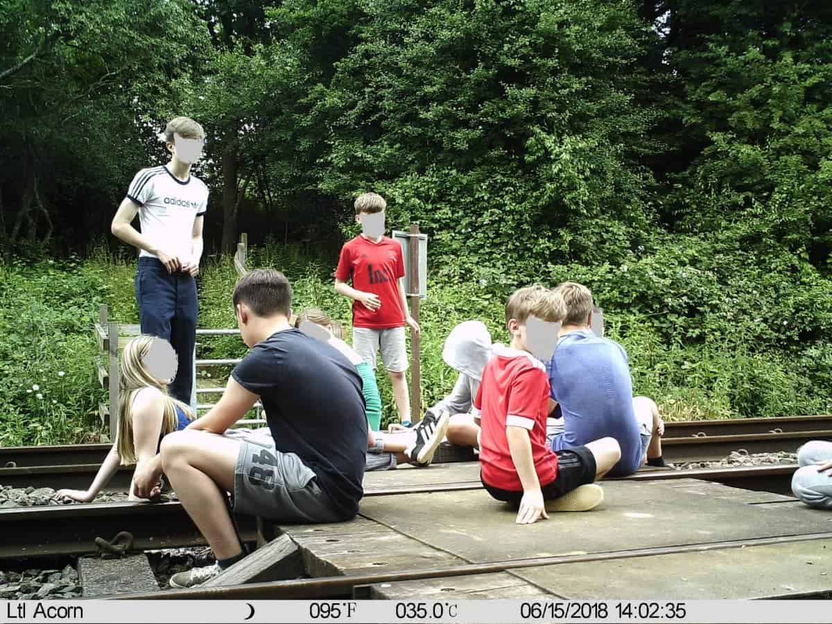 Shocking pictures show children hanging around on level crossing