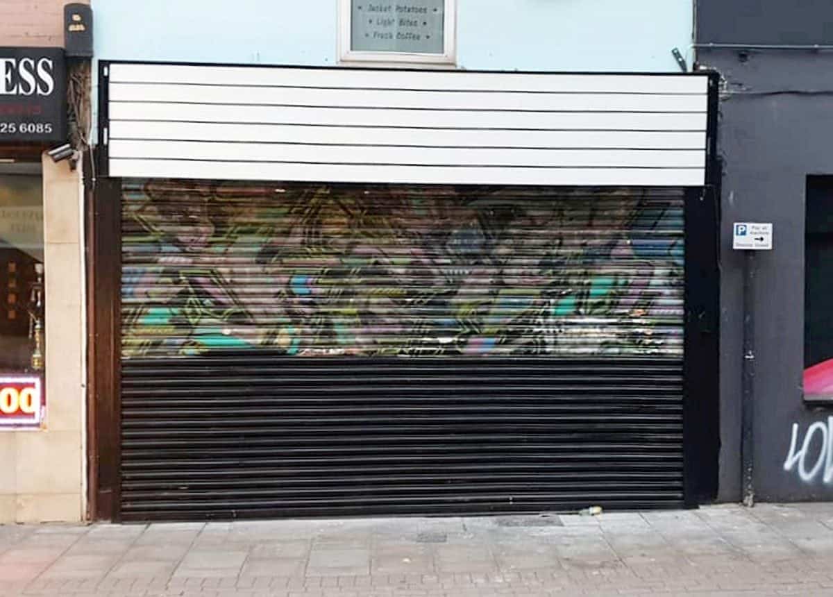 Early Banksy mural accidentally painted over by new shop owners
