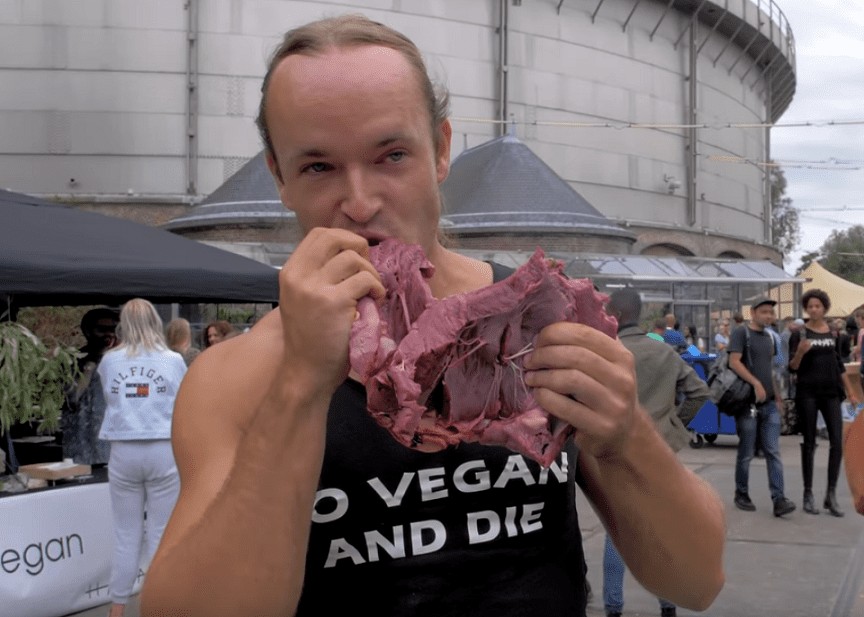 Man eats raw veal heart to taunt vegans at food festival