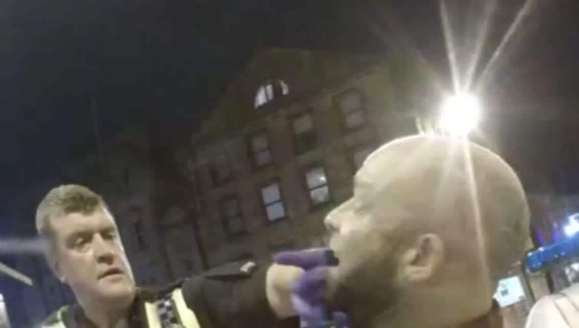 Watch – Moment drunk thug acted “like a savage” by biting down on a police officer’s FINGER