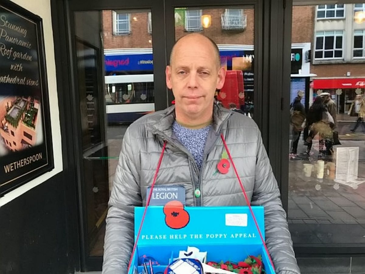 Poppy seller .Pete West, 47, who was forced to stand in the rain - after a Wetherspoons pub manager told him he couldn't use the pub's concrete canopy.See SWNS story SWPLpoppy.Pub chain Wetherspoons has apologised after staff forced a poppy seller who was seeking shelter outside one of their pubs - to stand out in the rain.Pete West, 47, was selling the Royal British Legion's decorative poppies to passers-by as the heavens opened.To stay dry, Pete stood under a concrete canopy which forms part of The Chevalier pub in Exeter, Devon.But the manager of the pub came out and told Pete he wouldn't be able to stand there as they didn't have a license. (SWNS)