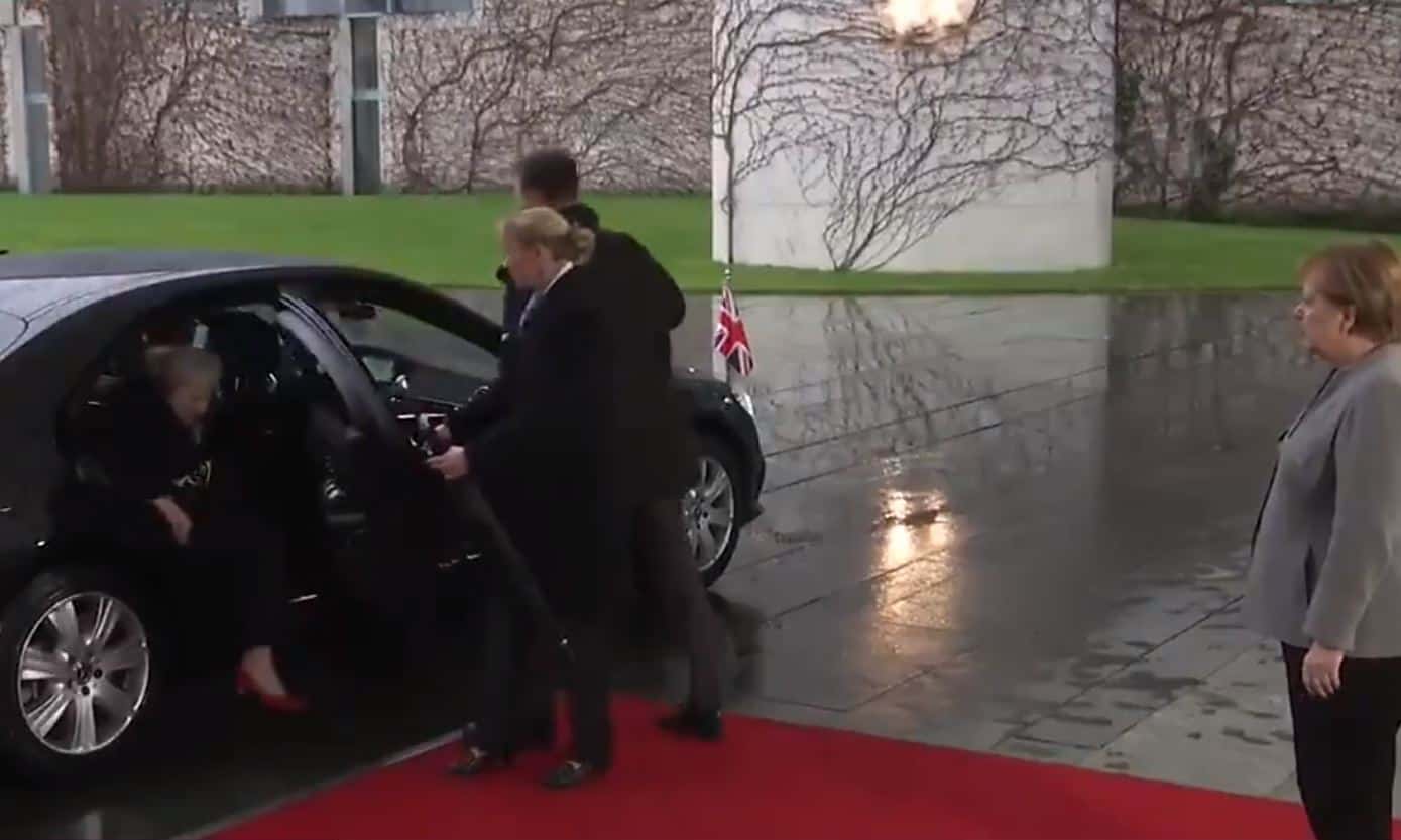European leader watches as Theresa May fails to exit her own car