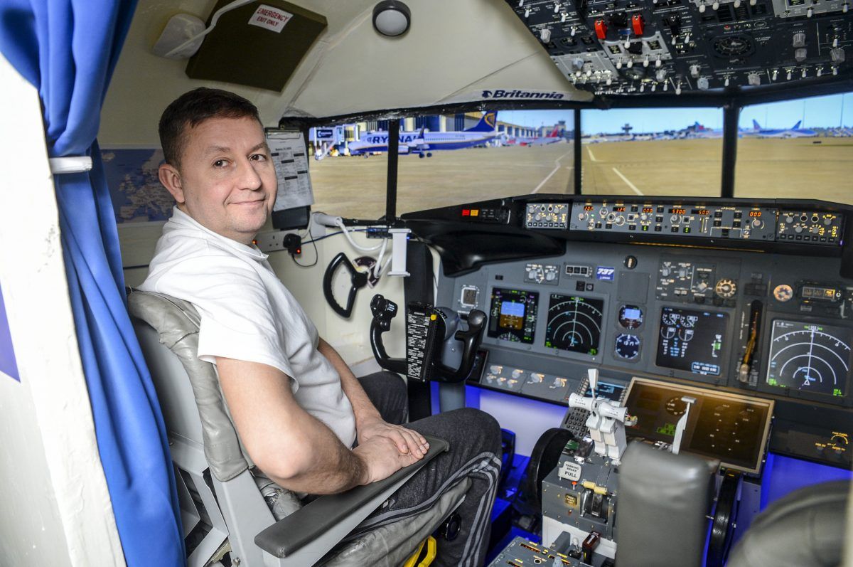 Plane-loving father of two builds flight simulator in dining room