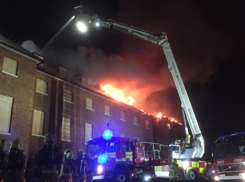 Firefighters at the scene of a blaze at empty NHS hospital