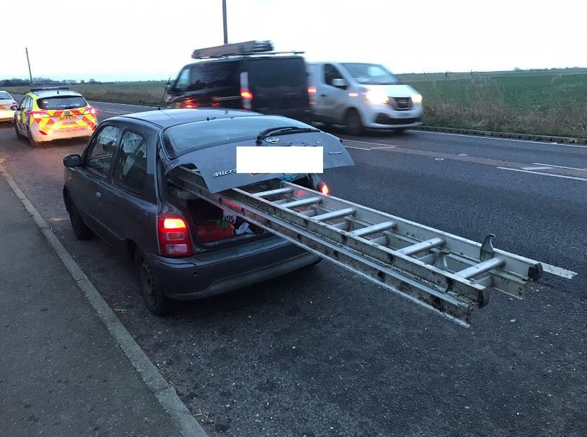 Car stopped by police after they spotted a large ladder sticking out of its boot