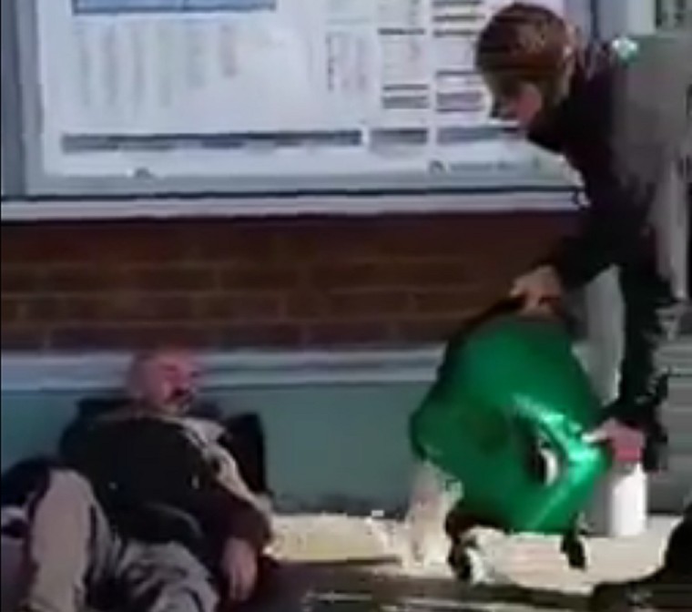 Watch: Southern rail workers chuck dirty water on homeless man outside train station