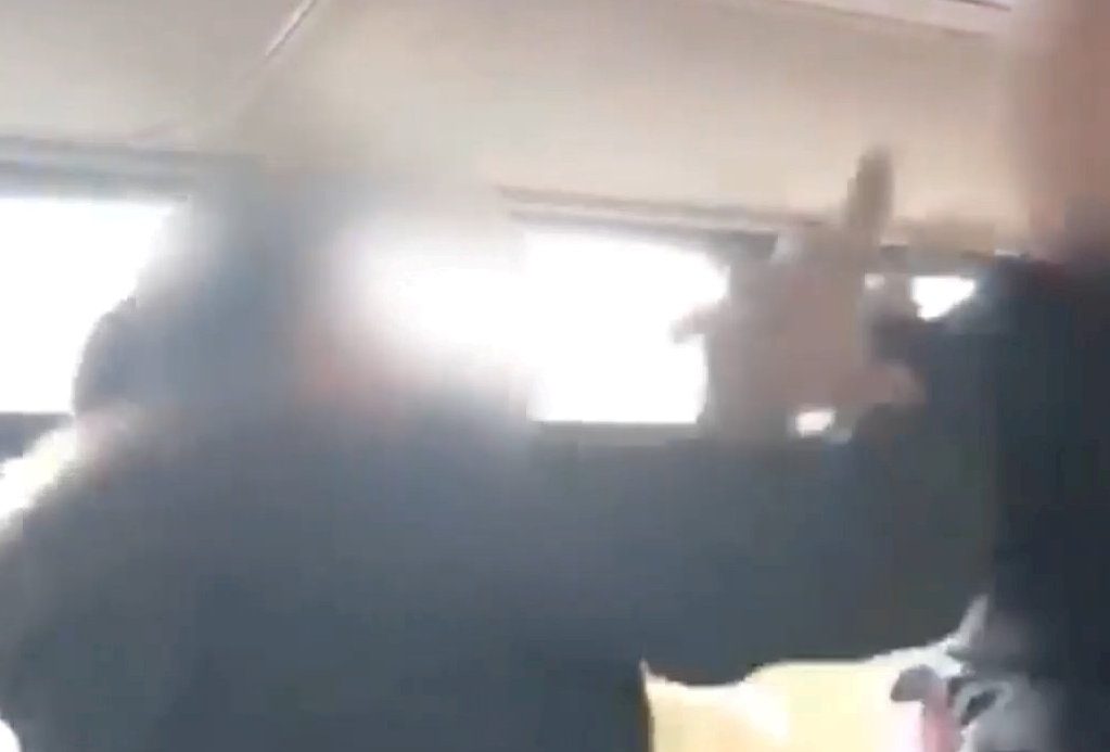 Video shows two women landing blows on each other in the middle of a city bus