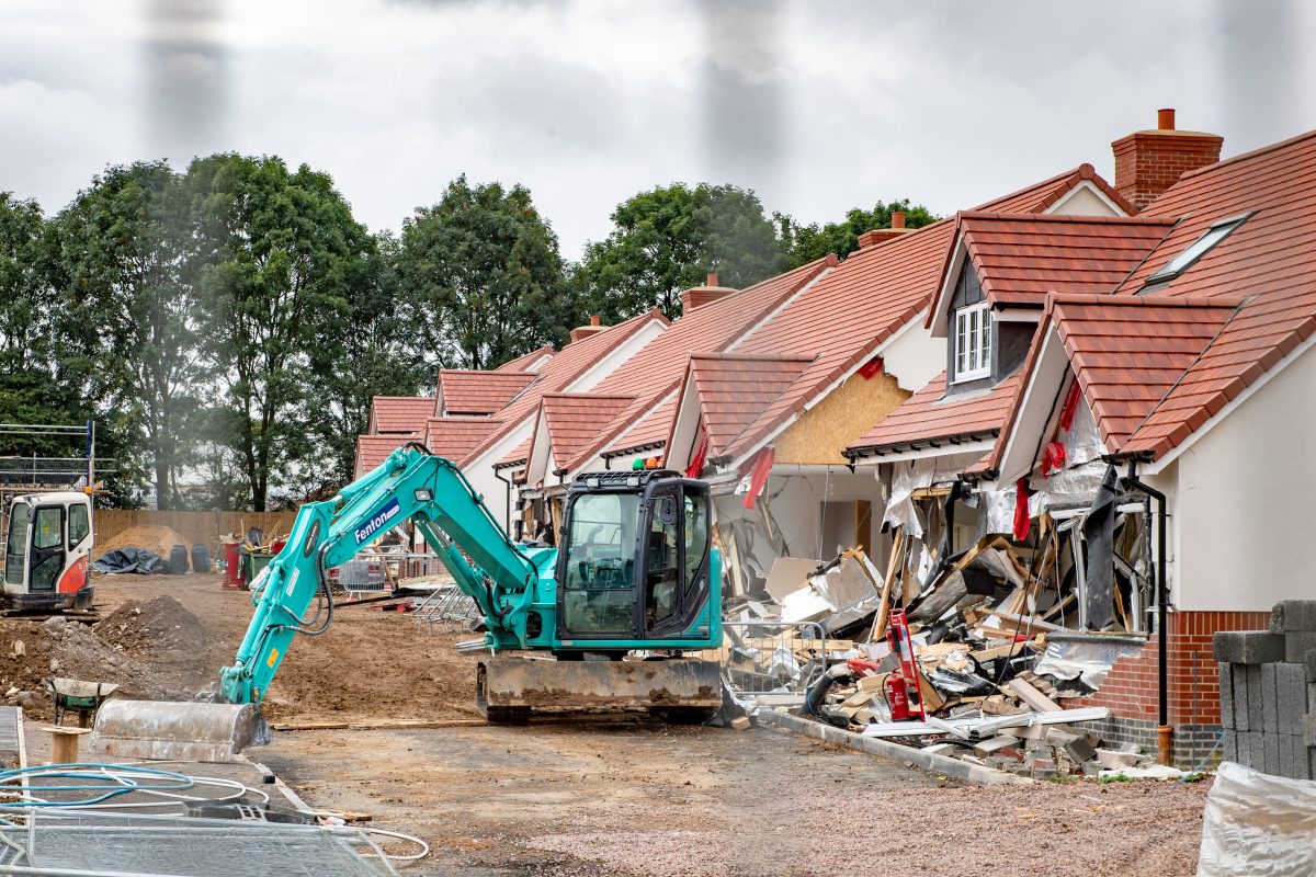 Sacked builder who tore down row of new-build houses with digger appears in court