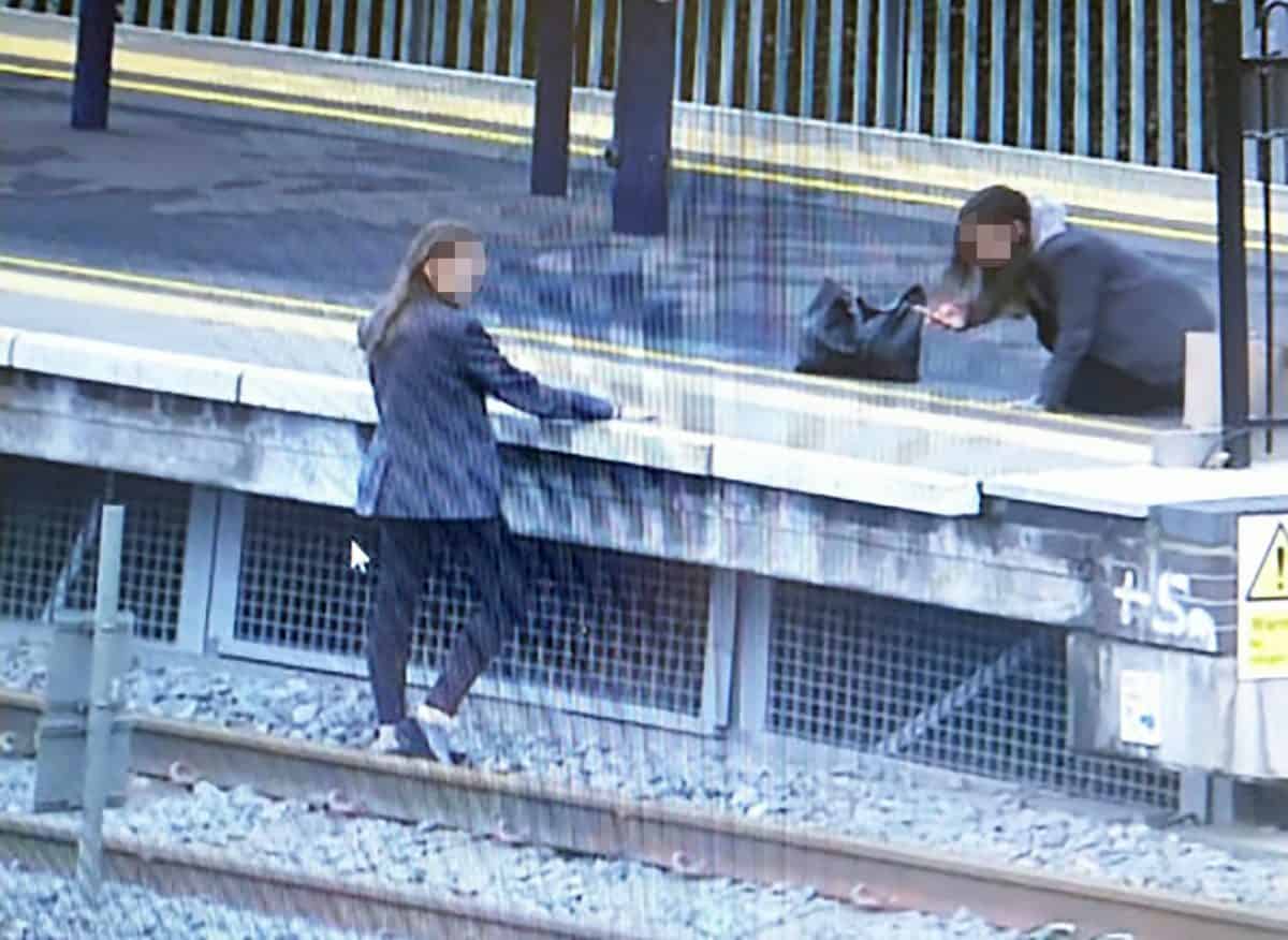 Two schoolgirls caught risking their lives by posing for selfies on train tracks