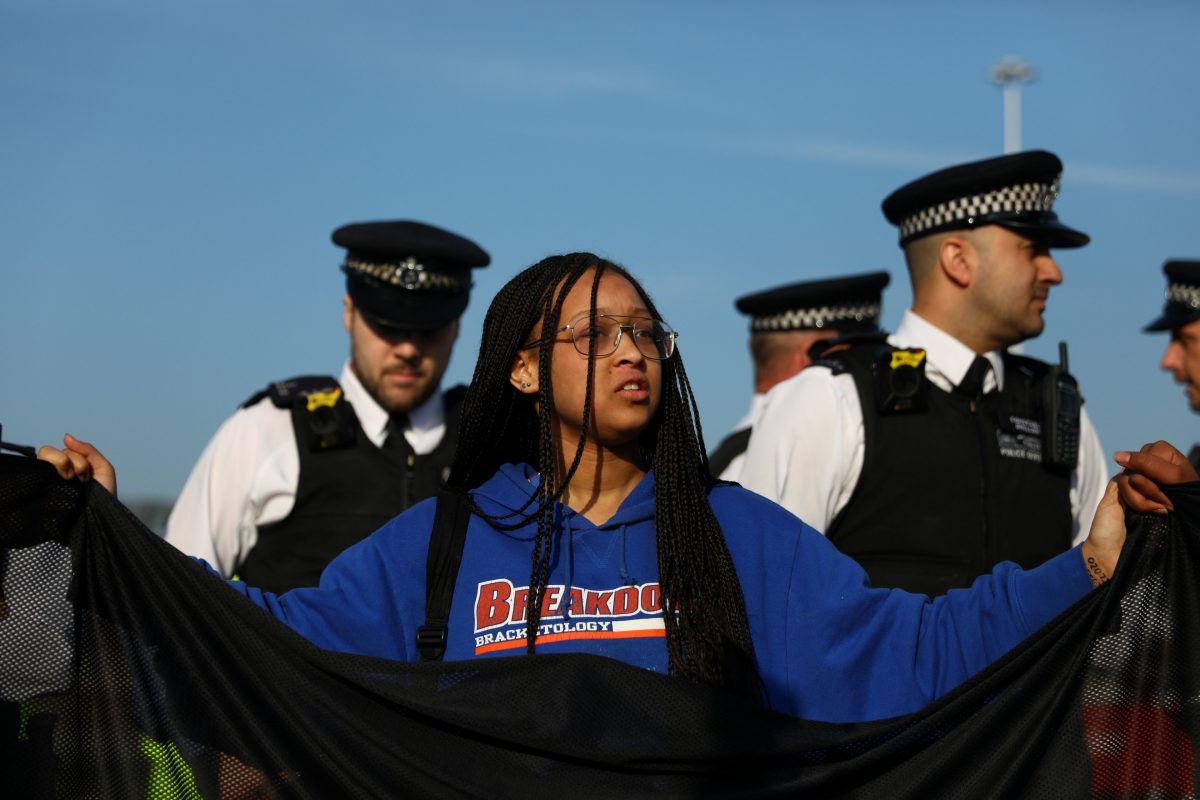 climate protestors at Heathrow (c) SWNS