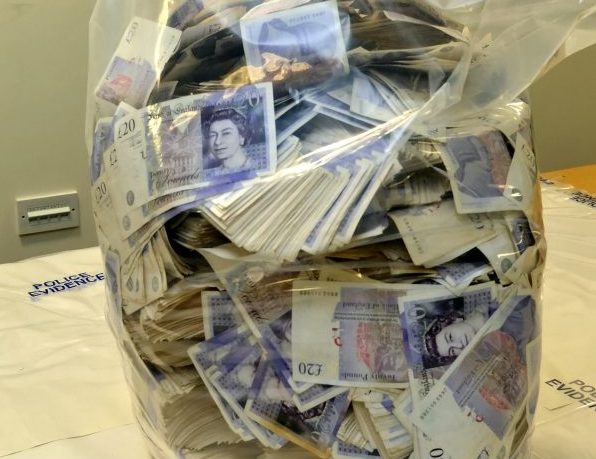 Money launderer caught trying to fly abroad with £1.5million in cash stuffed in luggage
