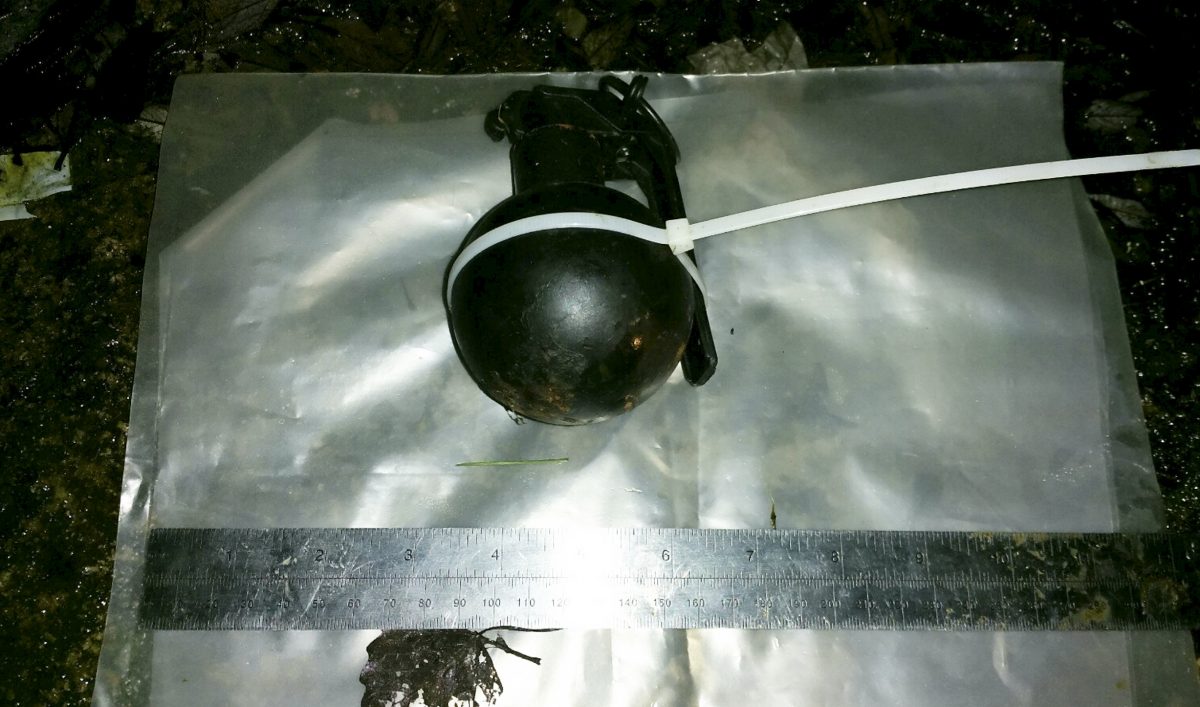 Armed officers find gun and a grenade on suspect