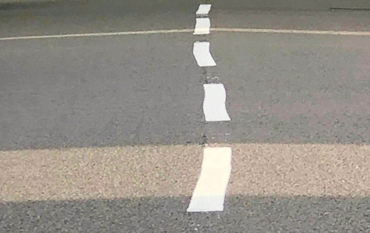 Bungling workmen forced to apologise for painting wonky lines on road