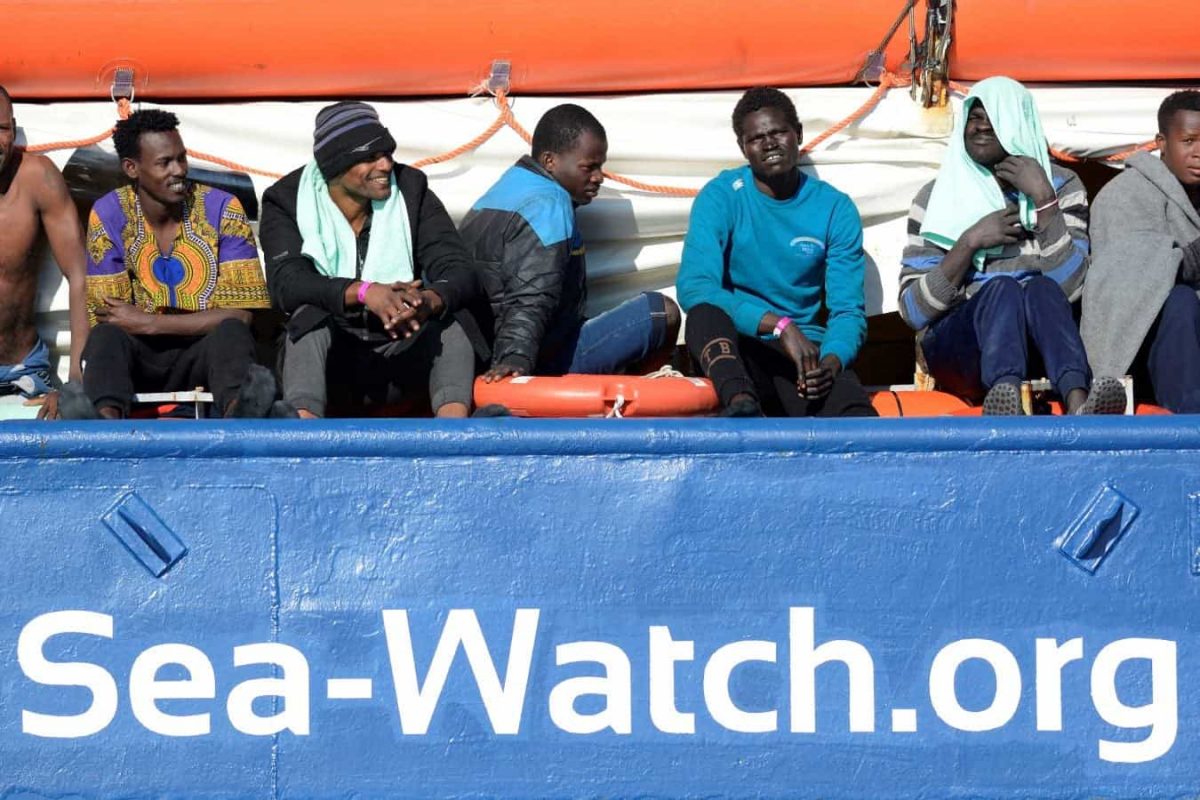FILE PHOTO: Migrants rest on board the Sea Watch 3 off the coast of Siracusa, Italy, January 27, 2019. REUTERS/Guglielmo Mangiapane/File Photo