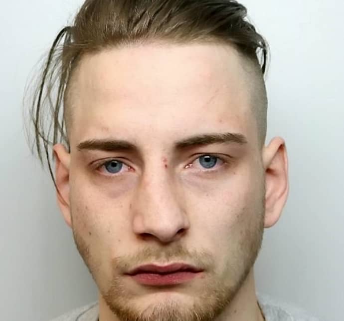 Thug who robbed man as he lay dying in street facing life in jail after being convicted of murder