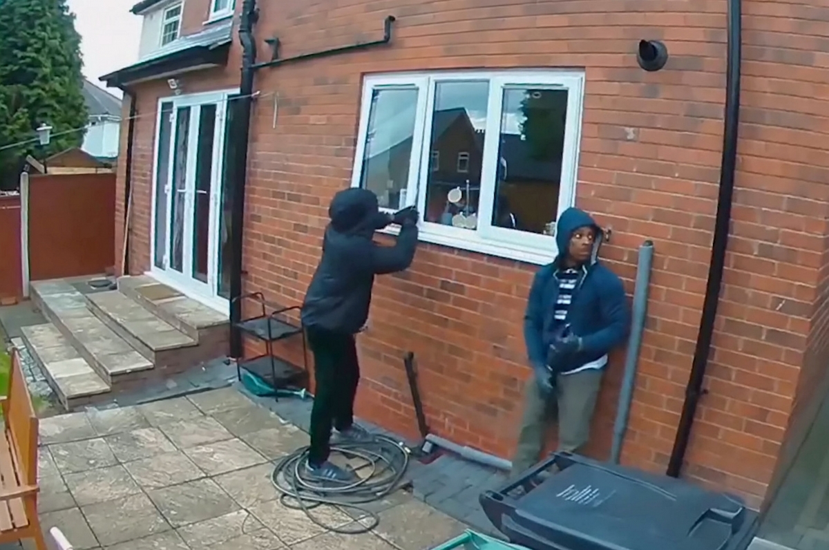 Dopey burglars caught on crystal clear CCTV breaking into a house in broad daylight