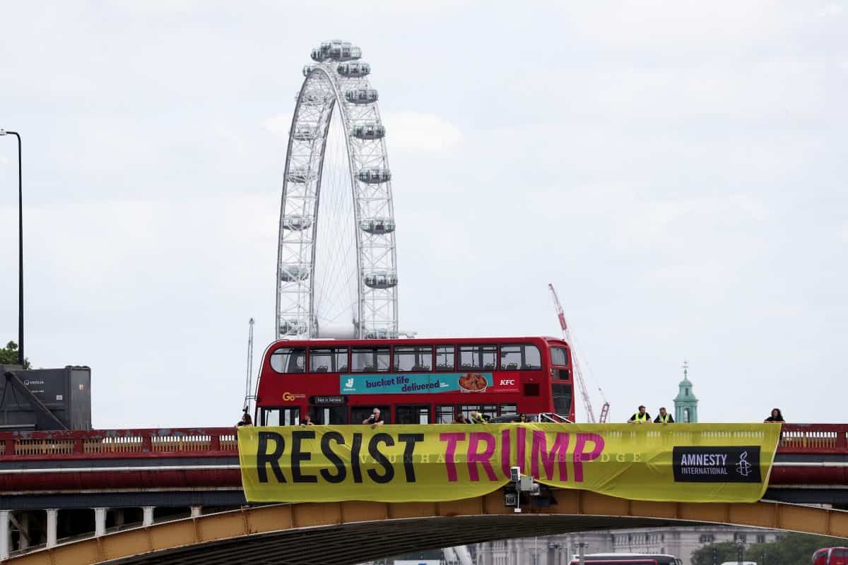 Protesters unfurled banners opposite US Embassy to “resist” US president’s “trashing of human rights”