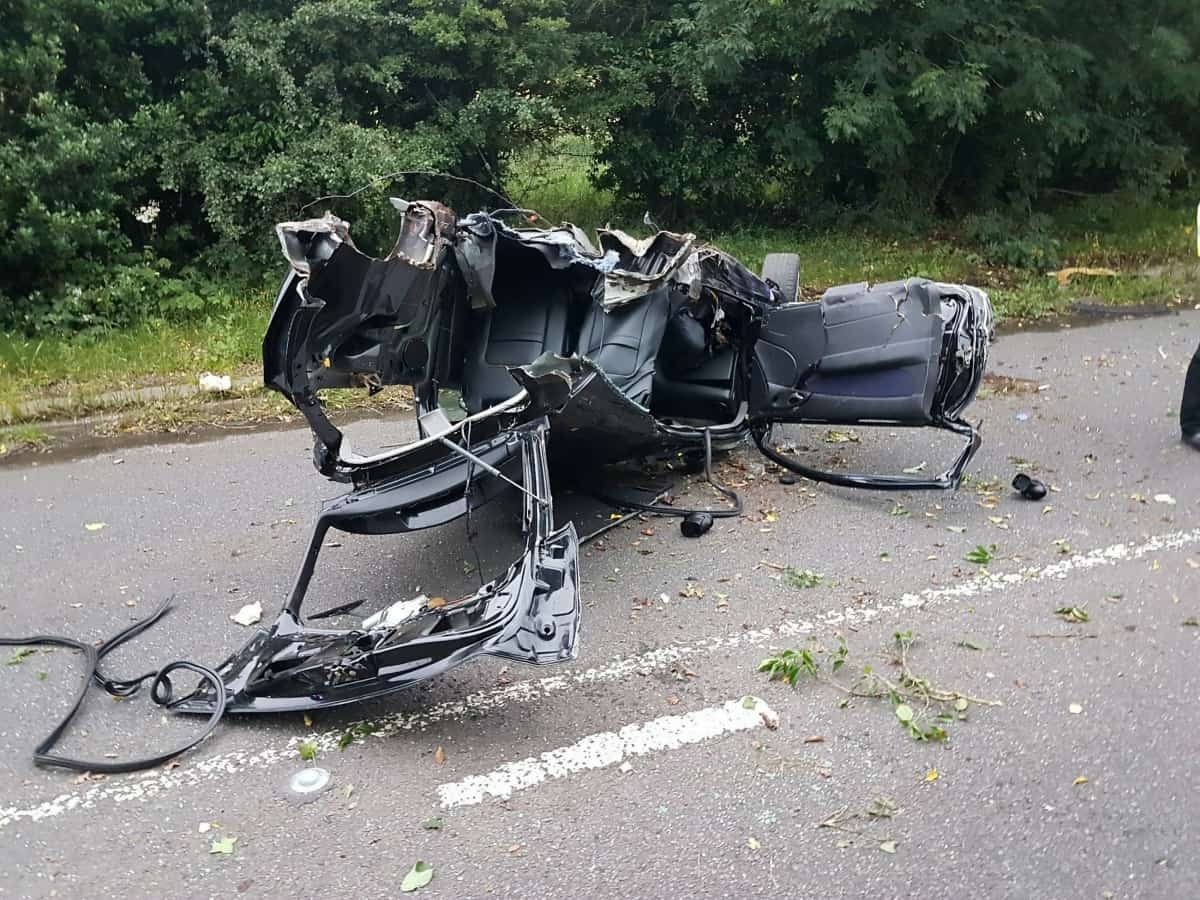 Driver cheats death after his car is split in two in horrific head-on crash