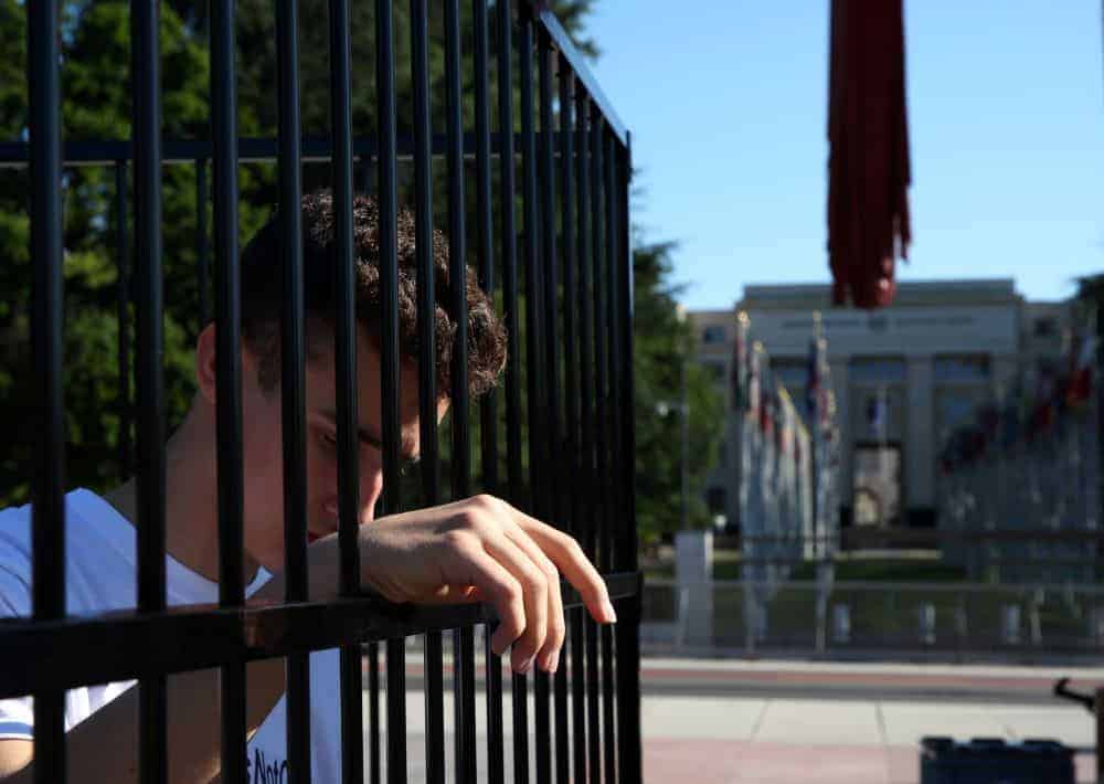 Teens stand in cage outside U.N. building to protest U.S. immigration policy