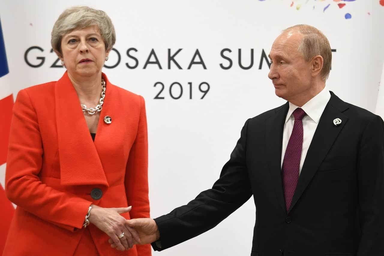 ‘The look of love’ – Theresa May and Vladimir Putin’s handshake brings awkwardness to new heights