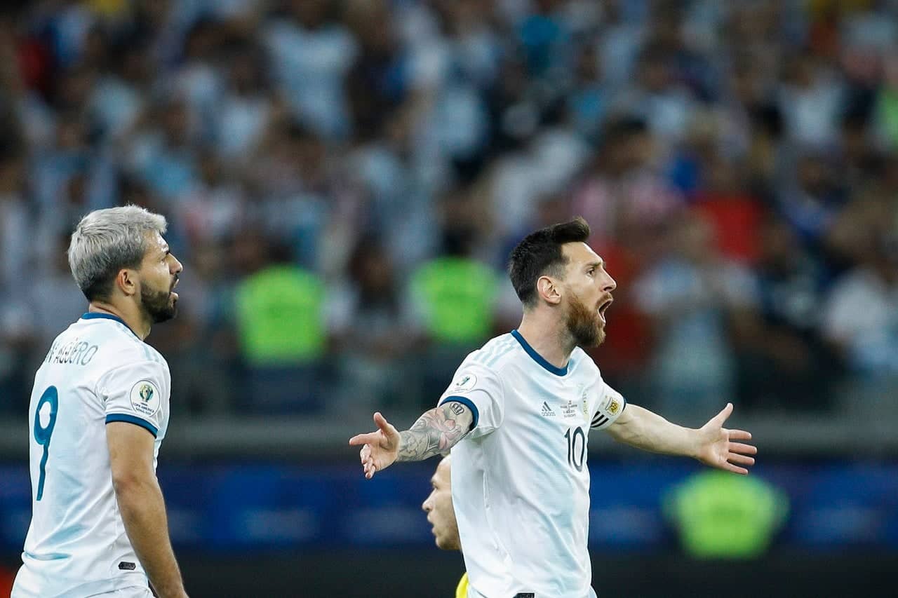 Messi believed Argentina should have had a penalty for a foul on Aguero (left) (AP Photo/Victor R. Caivano)