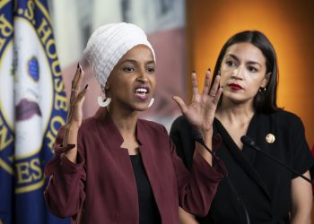 U.S. Rep. Ilhan Omar, D-Minn., left, joined at right by U.S. Rep. Alexandria Ocasio-Cortez, D-N.Y., responds to base remarks by President Donald Trump after he called for four Democratic congresswomen of color to go back to their "broken" countries, as he exploited the nation's glaring racial divisions once again for political gain, during a news conference at the Capitol in Washington, Monday, July 15, 2019. All four congresswomen are American citizens and three of the four were born in the U.S. Omar is the first Somali-American in Congress. (AP Photo/J. Scott Applewhite)