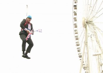 Boris Johnson gets stiuck on a zipwire (PA)