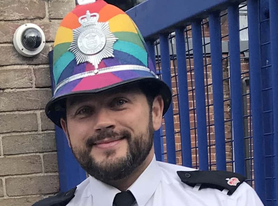 Senior police officer celebrates in style as he is spotted at Pride event wearing LGBTQ+ helmet