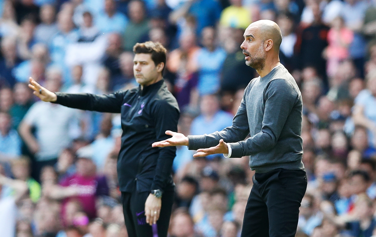 Tottenham Hotspur manager Mauricio Pochettino (left) and Manchester City manager Pep Guardiola on the touchline during the Premier League match at the Etihad Stadium, Manchester.