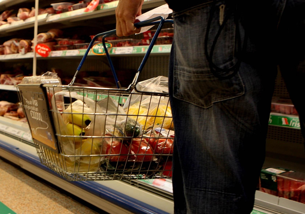 Undated file photo of a man holding a shopping basket in a supermarket. The price of food and drink will "go through the roof" if the UK leaves the EU without a deal, a new study suggests.