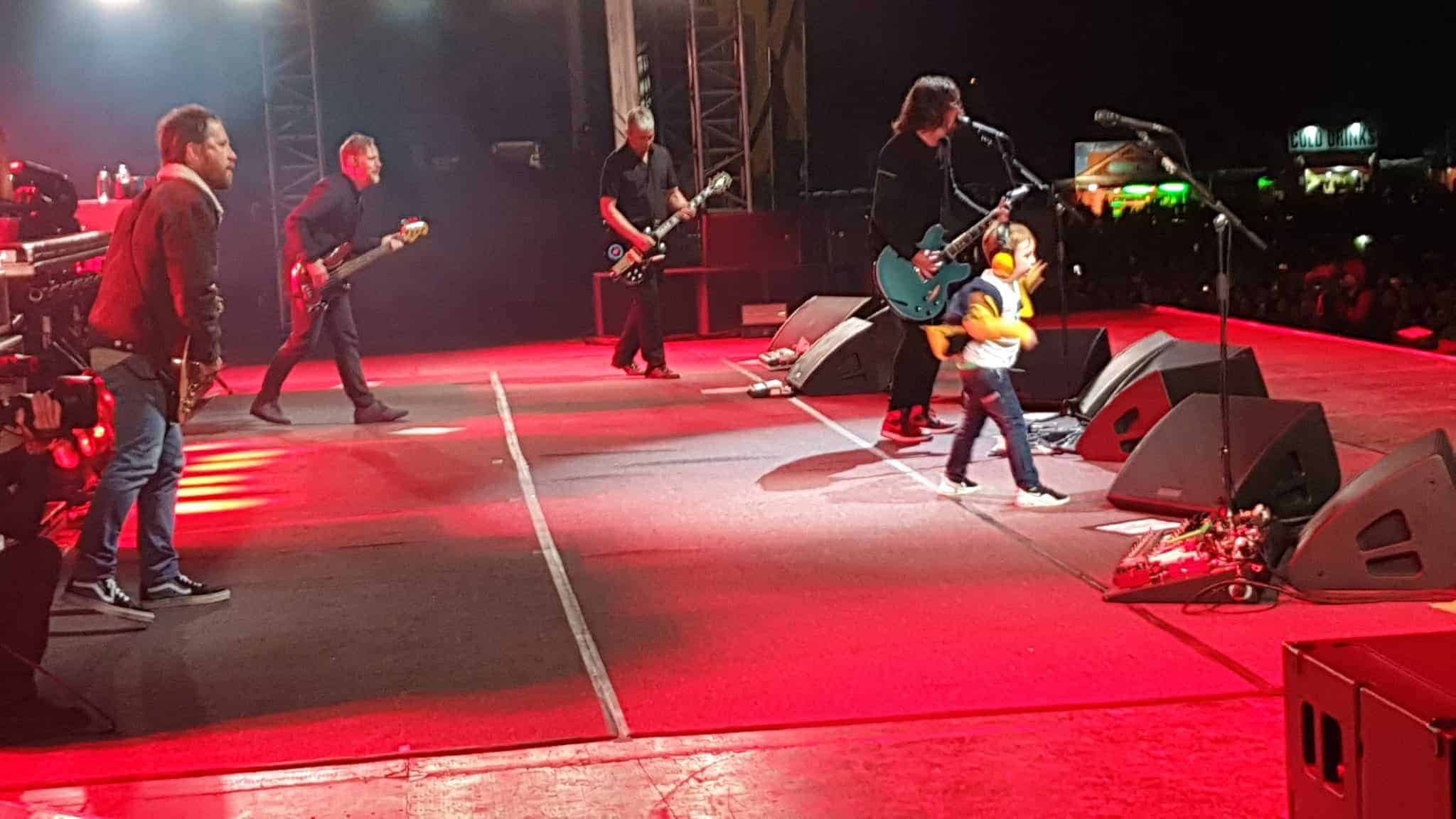 Boy, five, delights crowd by dancing on stage with Foo Fighters