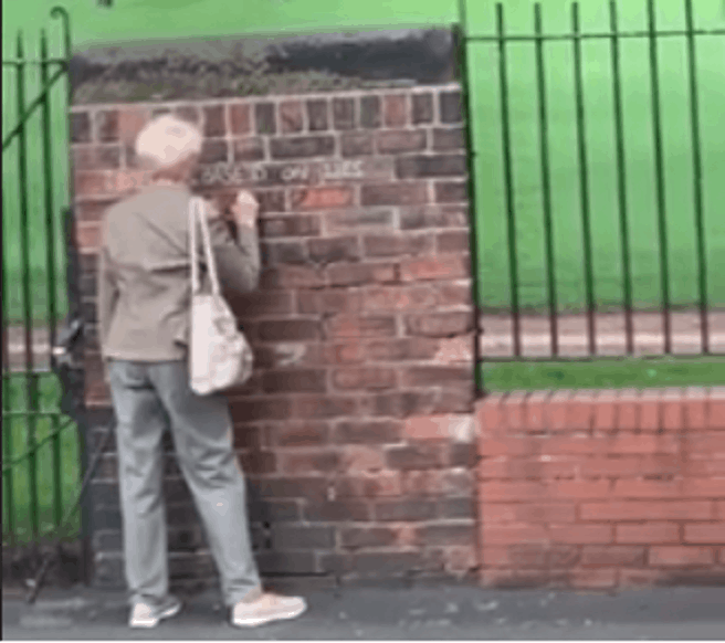 “Graffiti grandma” goes viral after scrawling anti-Brexit slogans on a wall using chalk