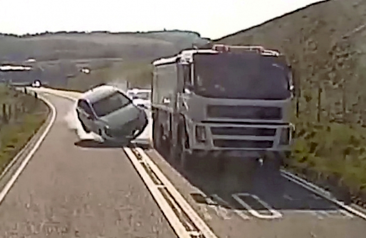 Watch – Driver smashing into lorry after overtaking THREE CARS on a blind bend