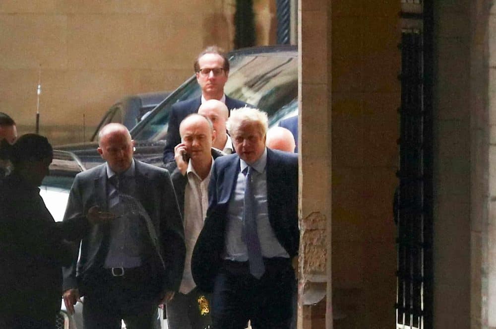 Boris Johnson and Dominic Cummings are seen outside Parliament as the embattled PM is set to address MPs, September 25 2019.