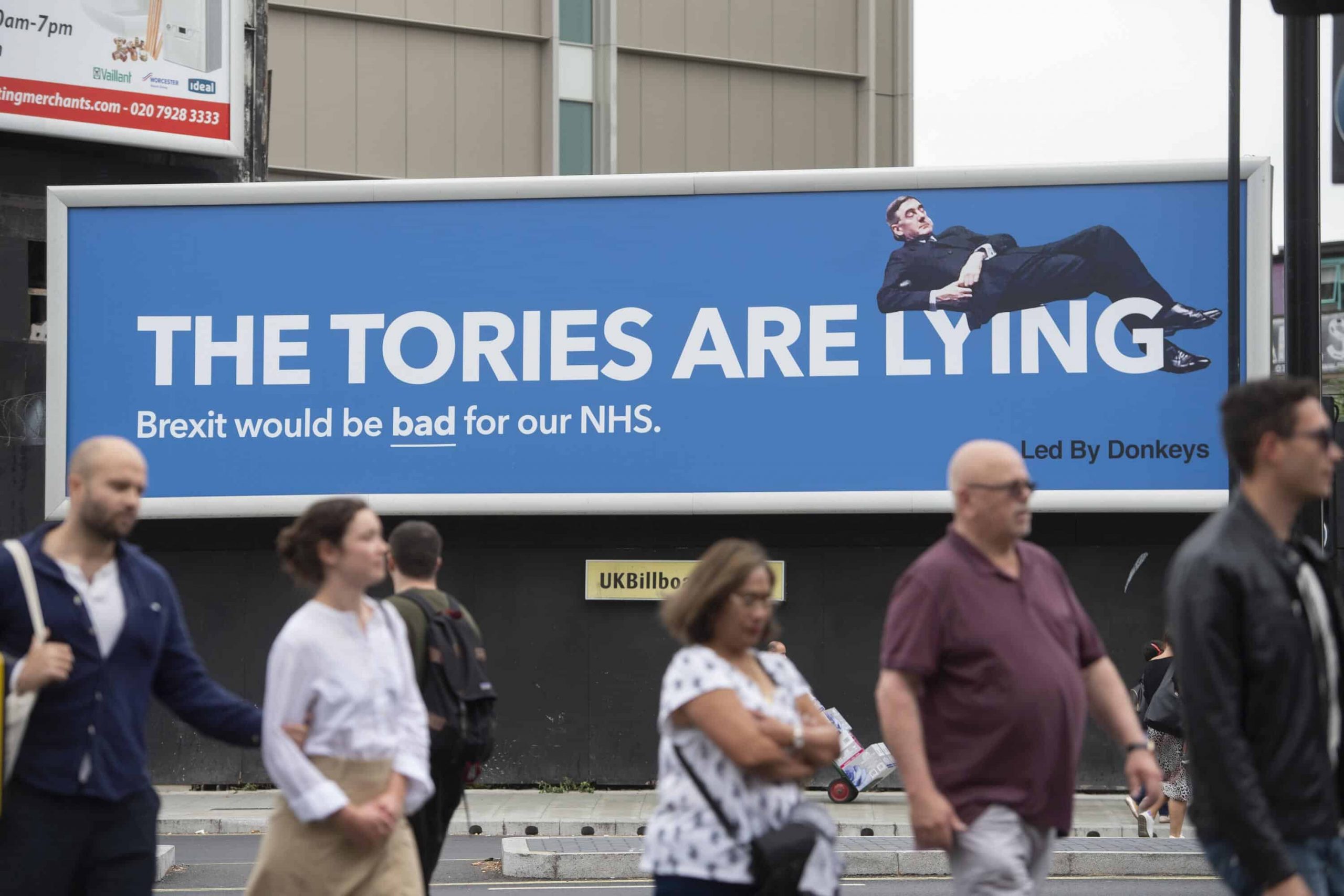 Reclining Jacob Rees-Mogg features on poster claiming Tories are lying about NHS