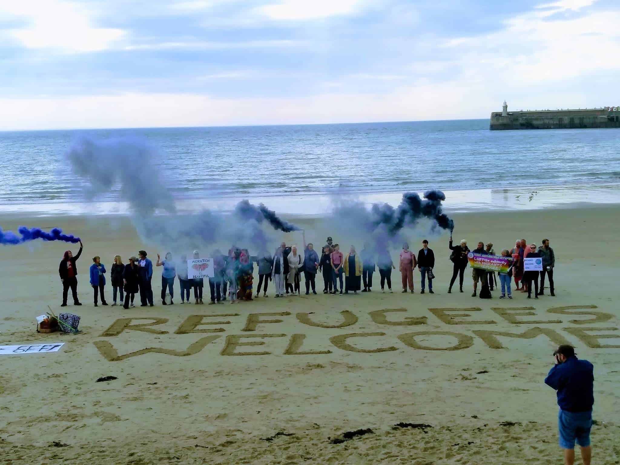 “Refugees Welcome” event held on beach targeted by far-right beach patrols
